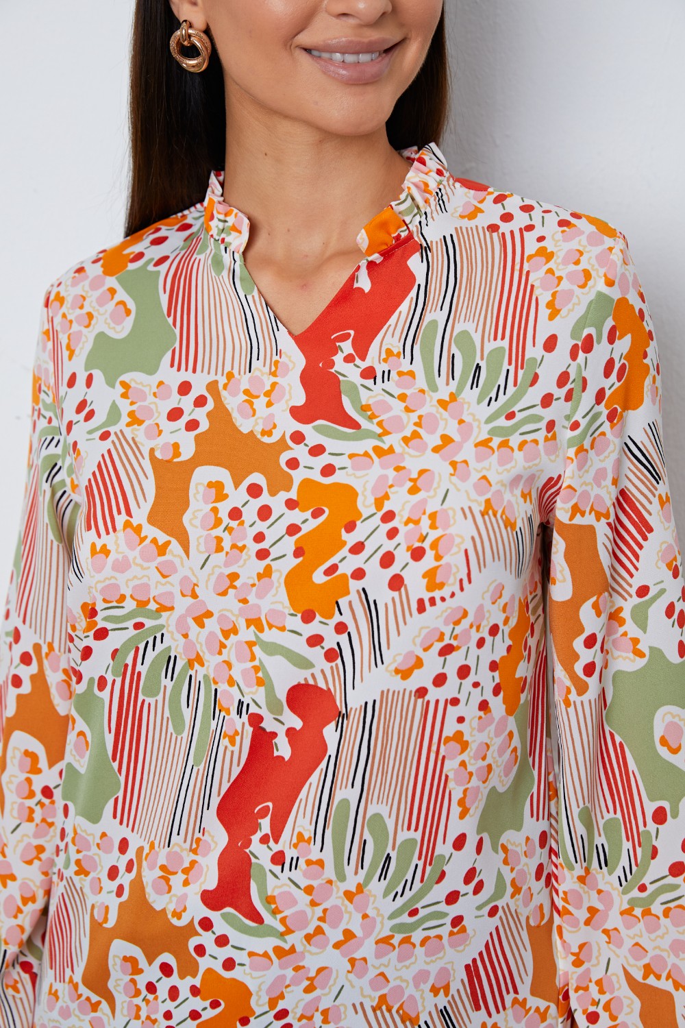 Blusa de manga larga con muescas y volantes florales